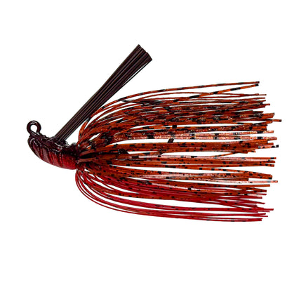 Fishing lure with red and black pattern on a white background